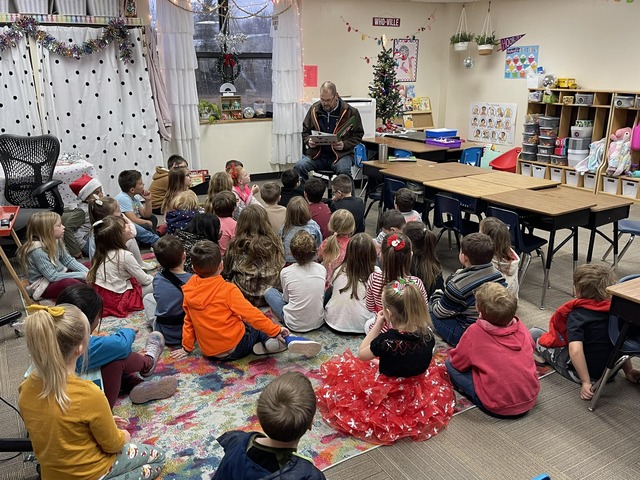 Dr. Cantrell reading to the 1st-graders. 