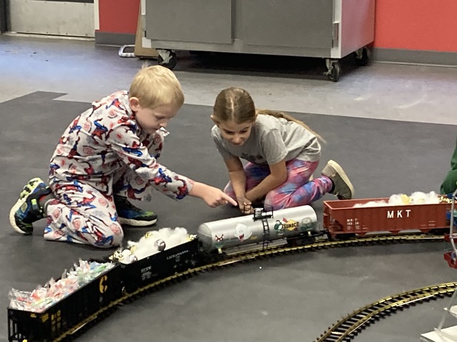 Gage showing his friend the train. 